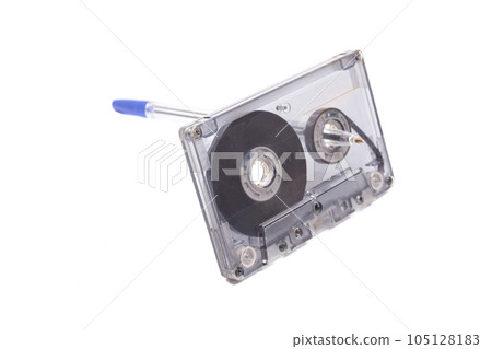Audio cassette tape with pen isolated on white background, vintage 80's music concept. 105128183
