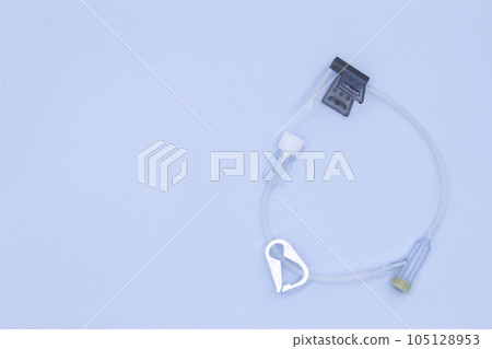 Winged needle set with Y injection port on blue background Winged needle set with Y injection port on blue background 105128953