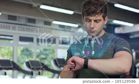 Active sport man in the gym check health indicator and heart rate on smartwatch. Future technology concept of humanity. 3D render animation. Active sport man in the gym check health indicator and heart rate on smartwatch. Future technology concept of humanity. 3D render animation. 105129586