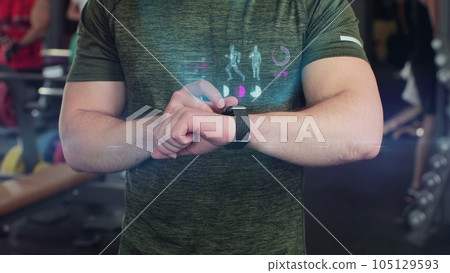 Close up of active sport man in the gym check health indicator and heart rate on smartwatch. Future technology concept of humanity. 3D render animation. Close up of active sport man in the gym check health indicator and heart rate on smartwatch. Future technology concept of humanity. 3D render animation. 105129593