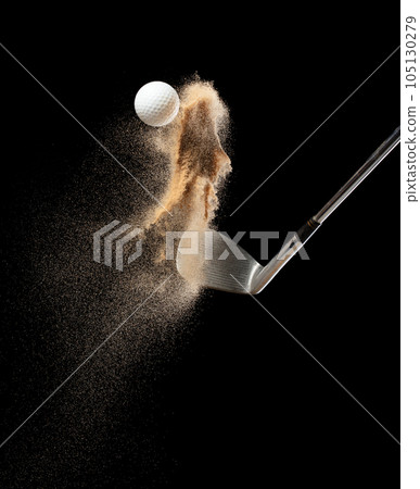 Golf ball tee explode from sand bunker. Golfer hit ball with club to sand explosion to green. Golf club hit ball tee in sand wedge bunker explosion. Black background isolated freeze motion Golf ball tee explode from sand bunker. Golfer hit ball with club to sand explosion to green. Golf club hit ball tee in sand wedge bunker explosion. Black background isolated freeze motion 105130279