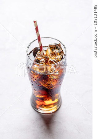 Refreshing glass of cola with ice Refreshing glass of cola with ice 105131498