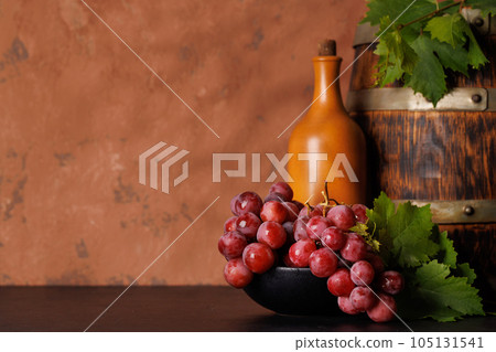 Wine bottle and grapes 105131541