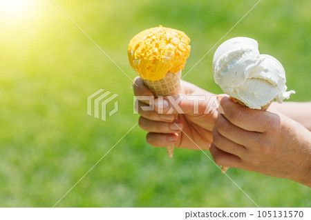 Refreshing ice cream in waffle cones with lemon flavour Refreshing ice cream in waffle cones with lemon flavour 105131570