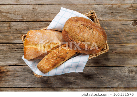 Assorted bread varieties in a basket 105131576