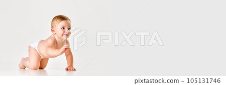 Beautiful, cute baby, girl, toddler in diaper crawling on floor against white studio background Beautiful, cute baby, girl, toddler in diaper crawling on floor against white studio background 105131746