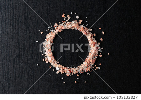 Pink salt on a black ceramic table. Pink salt on a black ceramic table. 105132827