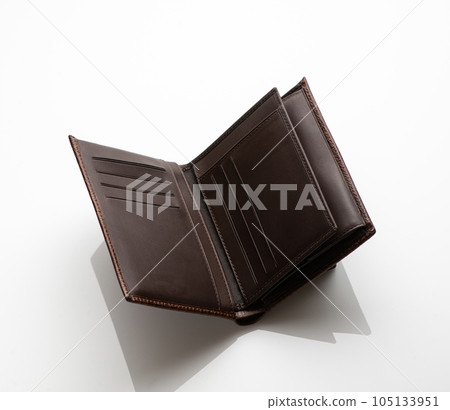 Close-up shot of a fashionable leather men's wallet on a white background with reflection Close-up shot of a fashionable leather men's wallet on a white background with reflection 105133951