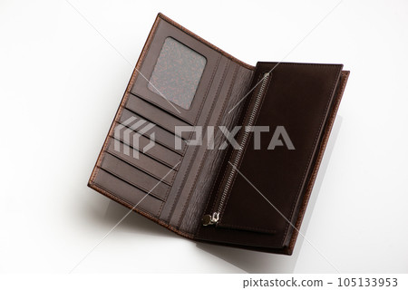 Close-up shot of a fashionable leather men's wallet on a white background with reflection Close-up shot of a fashionable leather men's wallet on a white background with reflection 105133953