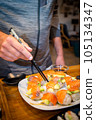 Overhead japanese sushi food. Maki ands rolls with tuna, salmon, shrimp, crab and avocado. Top view of assorted sushi. 105134347