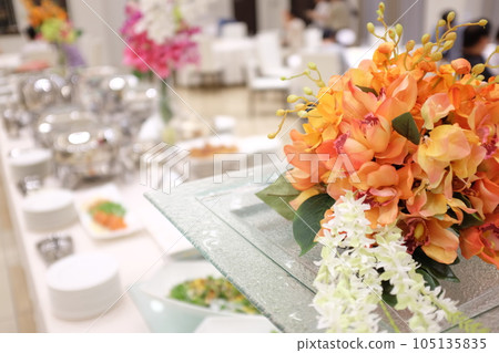Gorgeous orange flowers on the party table 105135835