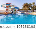 Empty small aquapark sliders with pool and palm trees at the morning, Tunisia 105138108