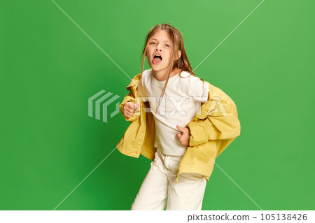 Emotional little girl dansing and singing. Concept childhood, education, human emotions, facial expression, ad 105138426