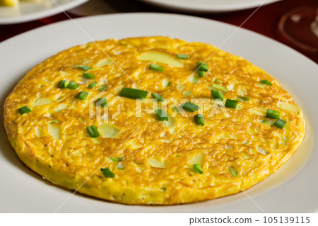 Spanish Omelette. Spanish omelette with potatoes and onion, typical Spanish cuisine. Spanish tortilla. Botulism outbreak. Spain. Spanish Omelette. Spanish omelette with potatoes and onion, typical Spanish cuisine. Spanish tortilla. Botulism outbreak. Spain. 105139115