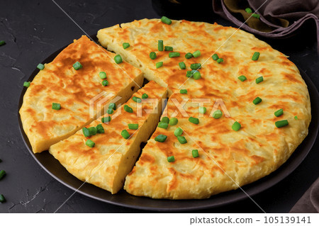 Spanish Omelette. Spanish omelette with potatoes and onion, typical Spanish cuisine. Spanish tortilla. Botulism outbreak. Spain. 105139141