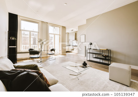 a living room with couches, coffee table and tv on the wall in it's centerpieces 105139347