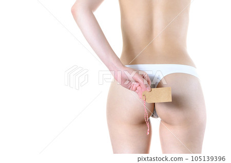 An image of a woman's small, toned and beautiful buttocks A woman in underwear holding a blank paper tag An image of a woman's small, toned and beautiful buttocks A woman in underwear holding a blank paper tag 105139396