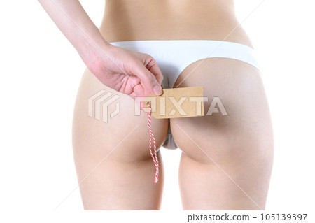 Image of a woman's small, toned and beautiful buttocks Cropped up of a woman in underwear with a blank paper tag Image of a woman's small, toned and beautiful buttocks Cropped up of a woman in underwear with a blank paper tag 105139397