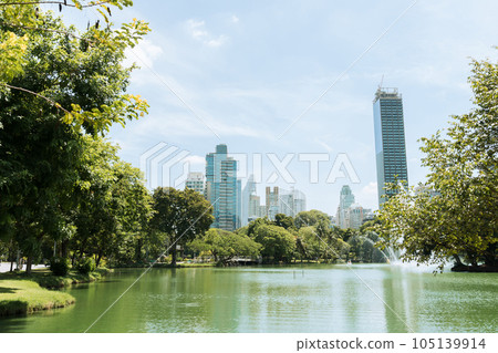 Lumpini Park green forest lake and buildings in Bangkok, Thailand Lumpini Park green forest lake and buildings in Bangkok, Thailand 105139914