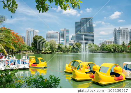 Lumpini Park green forest lake and buildings in Bangkok, Thailand Lumpini Park green forest lake and buildings in Bangkok, Thailand 105139917