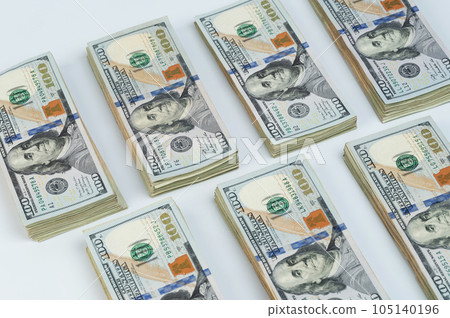 Many piles of 100 USA dollar billls 105140196