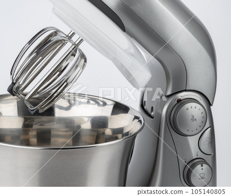 Chrome planetary mixer close up on white Chrome planetary mixer close up on white 105140805