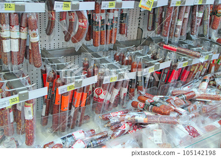 Shop of sausage and meat products. Wide selection of meat products in supermarket Shop of sausage and meat products. Wide selection of meat products in supermarket 105142198