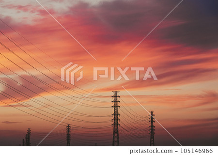 A power transmission tower lined up against the sunset-dyed sky c-2 film style A power transmission tower lined up against the sunset-dyed sky c-2 film style 105146966