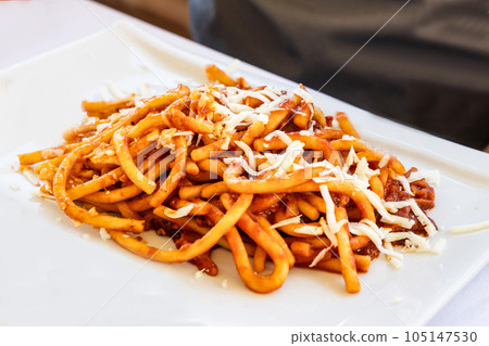 Pici is thick, hand-rolled pasta, like fat spaghetti. It originates in the province of Siena in Tuscany Italy Pici is thick, hand-rolled pasta, like fat spaghetti. It originates in the province of Siena in Tuscany Italy 105147530