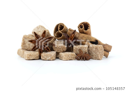 Brown sugar cubes cinnamon sticks and anise stars 105148357