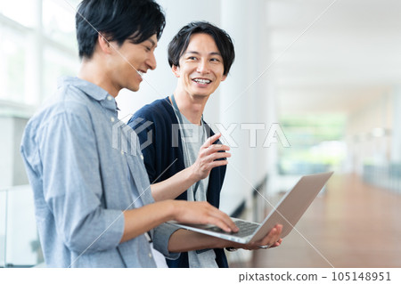 Young male engineers having a meeting in the office Young male engineers having a meeting in the office 105148951