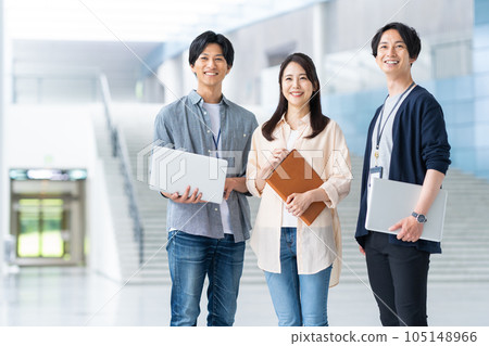 Young male and female engineers having a meeting in the office 105148966