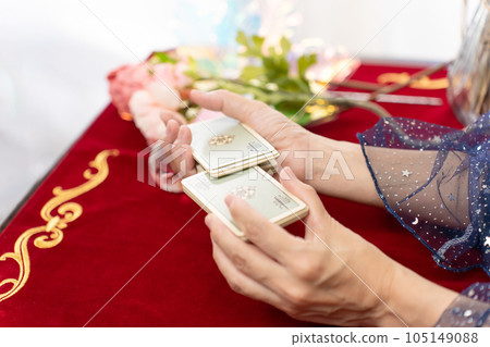 Fortune teller shuffling tarot cards Fortune teller shuffling tarot cards 105149088