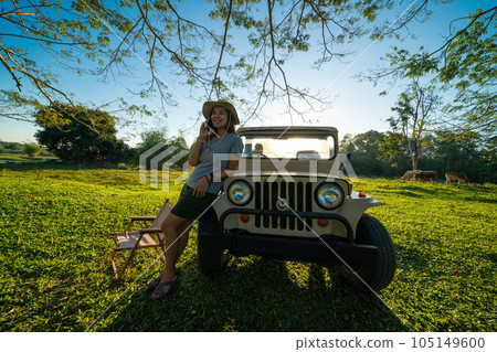 Asian adventure woman camping in tree froest with small truck car Asian adventure woman camping in tree froest with small truck car 105149600