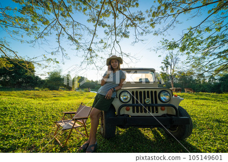 Asian adventure woman camping in tree froest with small truck car Asian adventure woman camping in tree froest with small truck car 105149601