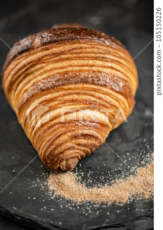 Crispy butter and cinnamon sugar croissant Crispy butter and cinnamon sugar croissant 105150226