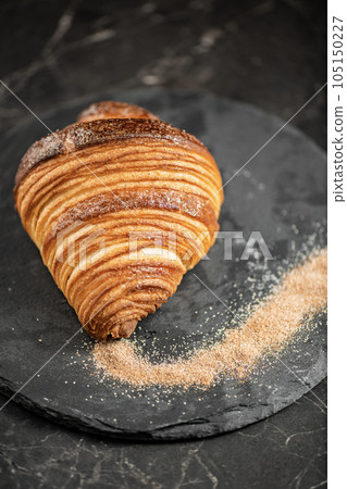 Crispy butter and cinnamon sugar croissant Crispy butter and cinnamon sugar croissant 105150227