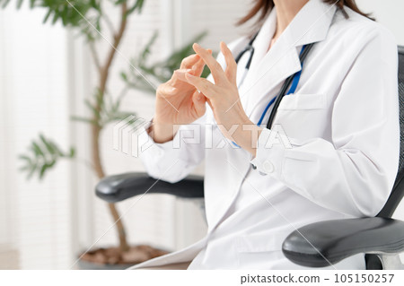 Woman in white coat medical 105150257