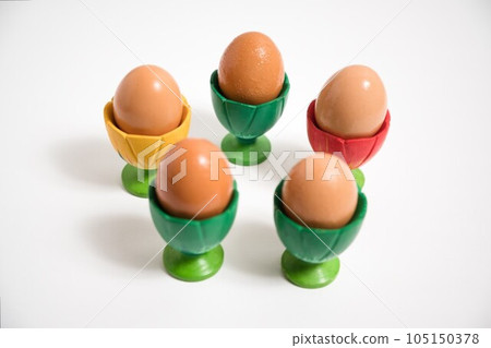 Chicken eggs in an egg cup. 5 servings. Chicken eggs in an egg cup. 5 servings. 105150378
