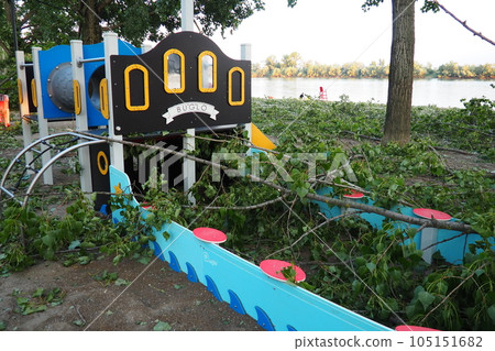 Aftermath of the hurricane July 19, 2023 Sremska Mitrovica, Serbia. Broken trees, mess on the streets. Broken branches on playground. Chips and trash. State of emergency after a catastrophic storm Aftermath of the hurricane July 19, 2023 Sremska Mitrovica, Serbia. Broken trees, mess on the streets. Broken branches on playground. Chips and trash. State of emergency after a catastrophic storm 105151682