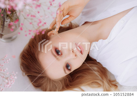Closeup portrait of young happy woman looking in camera Closeup portrait of young happy woman looking in camera 105152884
