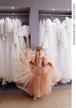Girl chooses a dress Girl chooses a dress 105152885