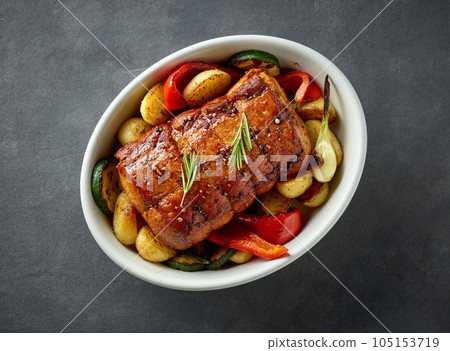 whole roast pork and vegetables 105153719