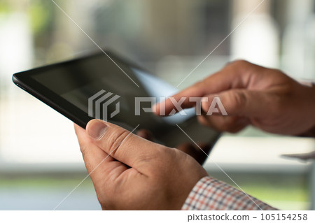 Man hands using looking and touch tablet laptop and cellphone communication mockup computer technology for tablet digital screen blank cyberspace online occupation internet 105154258