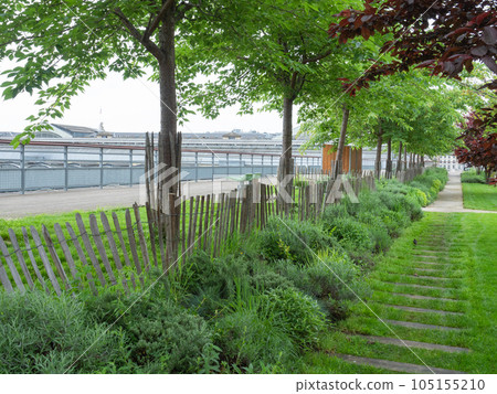 Paris, France - May 12th 2023: Beautiful green promenade above Gare de l'est Paris, France - May 12th 2023: Beautiful green promenade above Gare de l'est 105155210