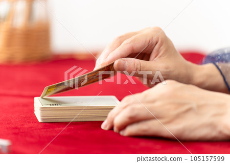 Fortune teller flipping tarot cards 105157599