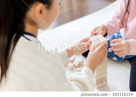 Children's hands doing building blocks 105158154