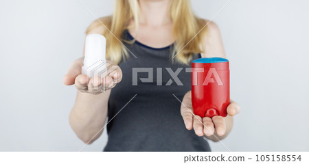 left or right. Girl chooses between eco-friendly deodorant without toxins and antiperspirant with toxic elements. In left hand Mineral alum crystal stick, in right hand classic remedy chemical nature left or right. Girl chooses between eco-friendly deodorant without toxins and antiperspirant with toxic elements. In left hand Mineral alum crystal stick, in right hand classic remedy chemical nature 105158554