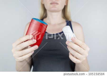 left or right. Girl chooses between eco-friendly deodorant without toxins and antiperspirant with toxic elements. In left hand Mineral alum crystal stick, in right hand classic remedy chemical nature left or right. Girl chooses between eco-friendly deodorant without toxins and antiperspirant with toxic elements. In left hand Mineral alum crystal stick, in right hand classic remedy chemical nature 105158584