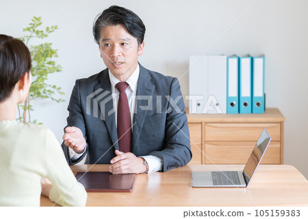 businessman serving customers businessman serving customers 105159383